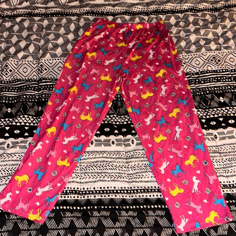 It’s a pink blue yellow and white pajama pants that is XL